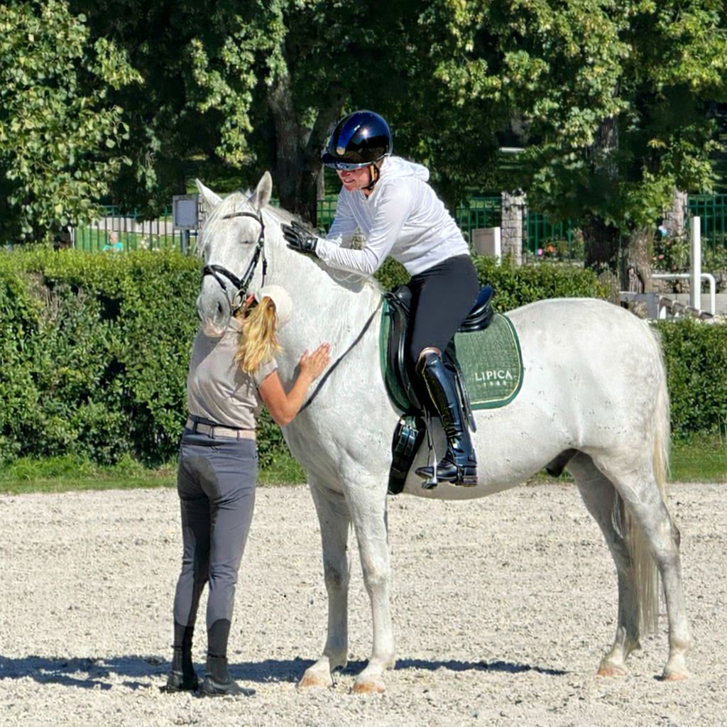 Elizabeth Landers with a Lipizzaner
